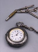 A Silver pocket watch and silver Albert chain