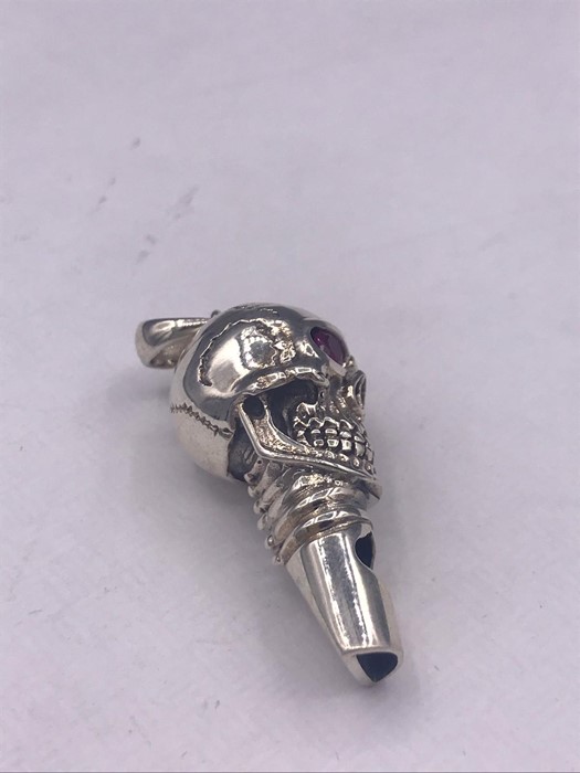 An unusual silver skull shaped whistle with ruby eyes - Image 3 of 3