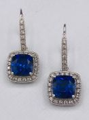 A Pair of earrings synthetic sapphires and diamonds