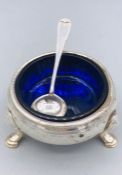 A silver salt with blue liner, indistinct hallmarks