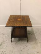 An occasional table with central inlay and similar to edges along with lower shelf with galleried