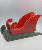 A Russian sleigh in wood.