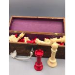 A Vintage red and white chess set with a chess board. Red King is 9cm tall.