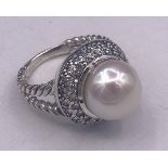 A silver CZ and freshwater pearl dress ring