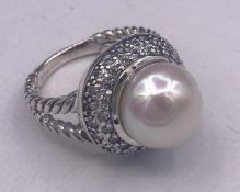 A silver CZ and freshwater pearl dress ring