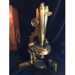 A R and J Beck Microscope in a case, No 6705 and a box of accessories