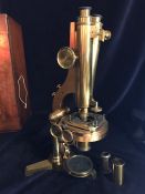 A R and J Beck Microscope in a case, No 6705 and a box of accessories