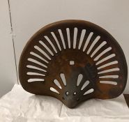 A Cast Iron rusty tractor seat