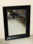 A Black framed mirror