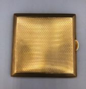 A 9ct gold cigarette case, machine tooled, (99.5g)