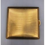 A 9ct gold cigarette case, machine tooled, (99.5g)