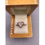 A Morganite and Diamond ring 3 carat trilliant cut, Morganite with three accent Diamonds set in