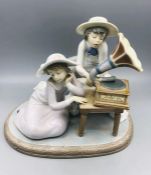 Lladro figure of two girls listening to a gramophone