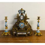 A French enamel and Ormolu clock with matching candlesticks