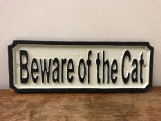 A Cast Iron sign Beware of The Cat.