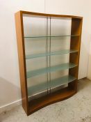 A Contemporary display unit with four glass, curved shelves. 190cm H x 140cm W