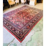 A Hand Tied rug 345cm x 245cm.