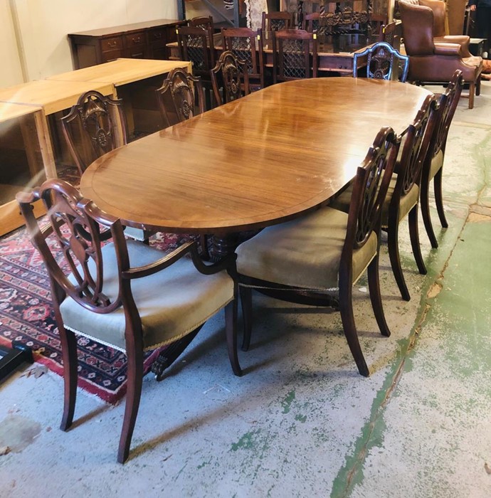 A Mahogany Dining table with two pedestals.