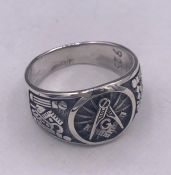 A gnt silver ring with masonic image