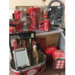 A Large collection of Coca-Cola promotional items and collectables.