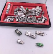 A selection of 53 miniature lead military vehicles.