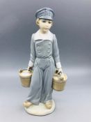 Lladro figure of a boy in clogs carrying water buckets