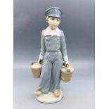 Lladro figure of a boy in clogs carrying water buckets