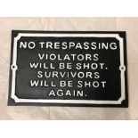 A Cast Iron sign 'No Trespassing Violators will be shot. Survivors will be shot again'