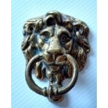 A Georgian brass lion mask door knocker, 12 x 9 cm