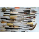 An assortment of forty late 19th century / early 20th century button hooks and shoe horns