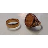 A half-sovereign gents signet ring, dated 1912, mounted on a 9ct gold band, size U, 11.01g and a