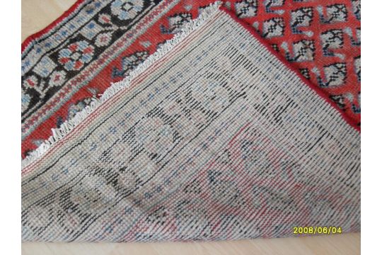 A Persian hand-knotted Hamadan scarlet-ground wool runner with multicoloured floral and foliate - Image 2 of 2