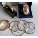 Two rolled gold vintage bangles and six other silver bangles (8)