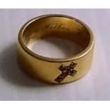 A Victorian yellow metal (testing for 18ct gold) mourning ring with diamond encrusted crucifix