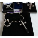 A selection of four gem-set crosses, 3 with silver chains, all boxed