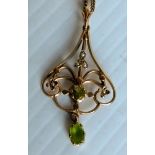 An Art Nouveau peridot and seed pearl pendant on 9ct yellow gold frame and neck chain, 45cm, 6.07g