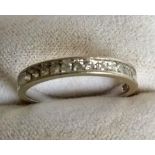 An 18ct white gold eternity ring set with diamond half-hoop, size N, 1.7g