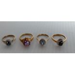 Four 9ct yellow gold rings set with various gem stones, 8.54g