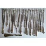 A selection of thirty-nine late 19th / early 20th century silver button hooks and one shoe horn, all