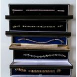 A collection of six silver gem set bracelets with individual cases (6)