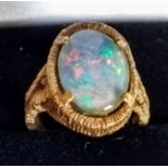 A 9ct yellow gold ring set with an oval opal, size J1/2, 5.62g