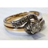 A mid 20th century 14ct yellow gold diamond ring with mounted baguette-cut stone, 4.3g