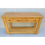 A contemporary light solid oak consul table with frieze drawers, 7 7H x 122 W x 40 cm D (legs 7x7