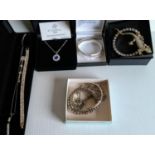 A quantity of costume jewellery, some silver mounted bangles, necklaces, etc (10)