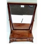 A Georgian mahogany vanity mirror on crutch supports with three drawers under,