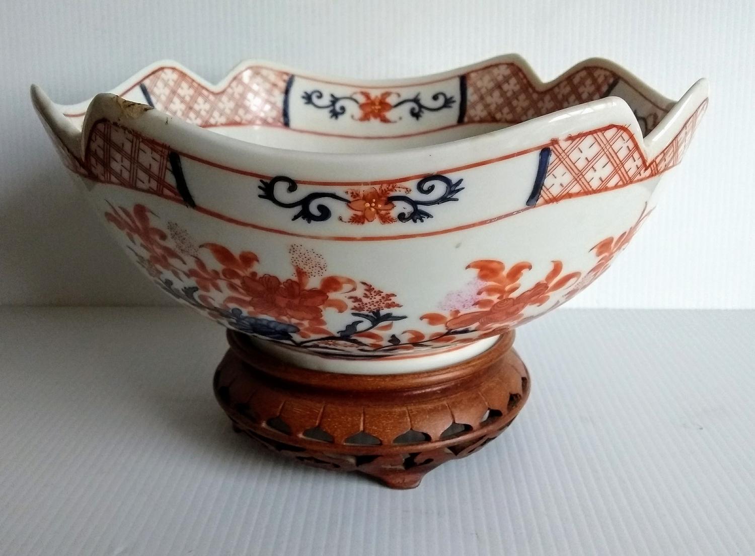 A late 19th century Japanese Imari Meiji period lotus-shape bowl with blue and ochre floral