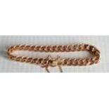 A 14ct rose gold curb link bracelet with safety chain, hallmarked 585, 35.32g