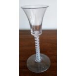 A Georgian waisted bucket bowl wine glass, raised on a multi-spiral air twist stem and conical foot,