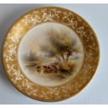 A Royal Worcester cabinet plate hand-painted by James Stinton, the central scene depicting cows at a