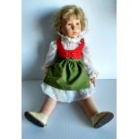 An early 20th century Kathe Kruse girl doll with blonde hair, painted face, stuffed pink muslin body